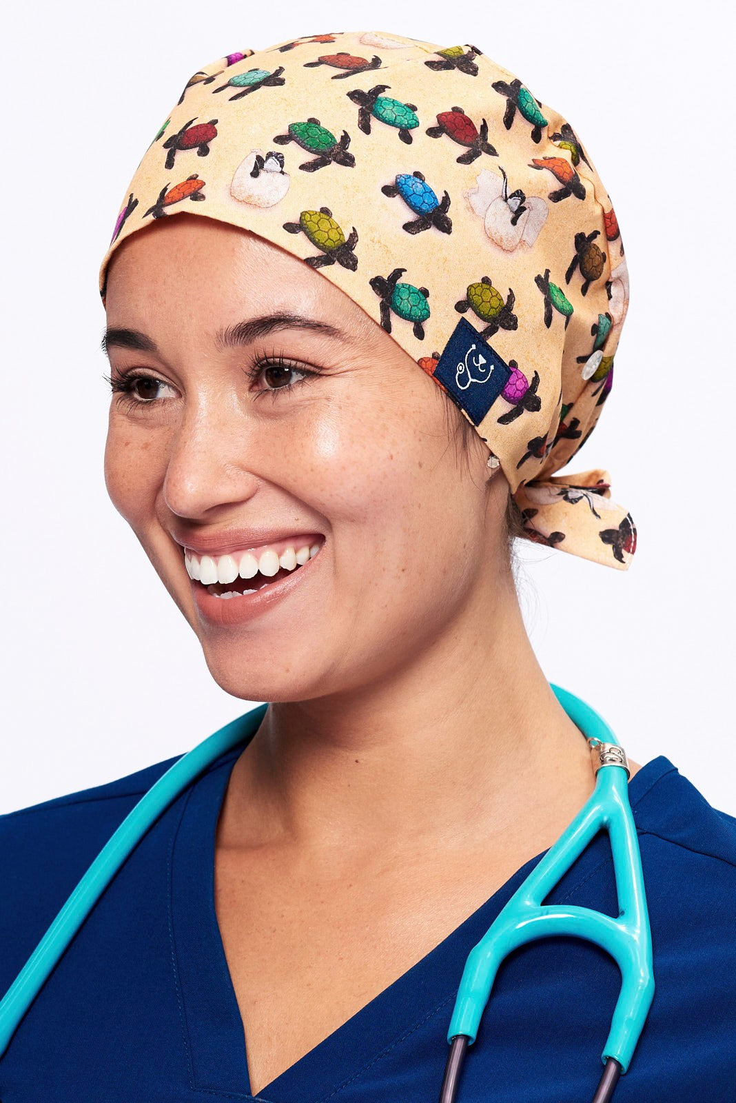 A Vet wearing a Dr. Woof Sea Turtle Surgical Scrub Cap