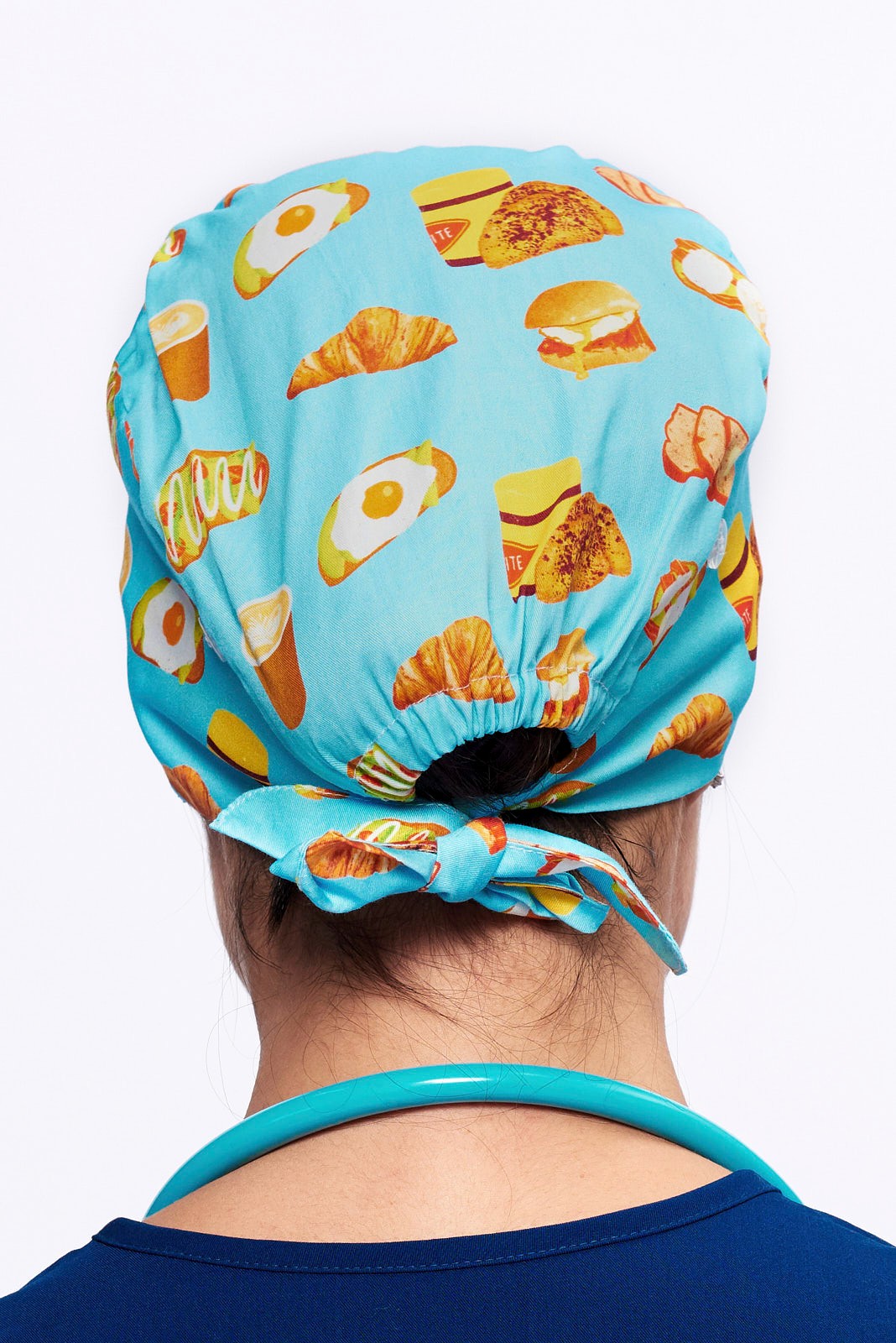 A Nurse wearing a Dr. Woof Brunch Bae Surgical Scrub Cap 